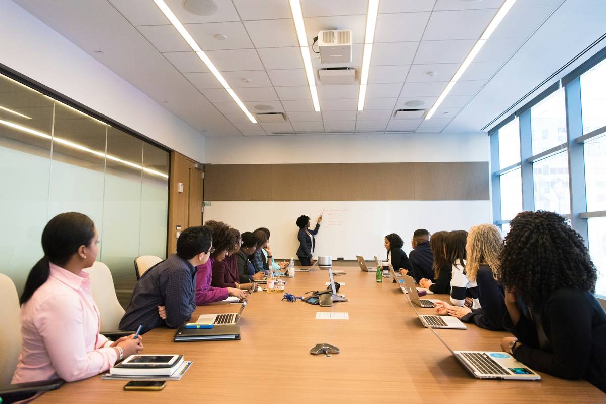 Infographic showing that poor collaboration costs companies $15,000 per employee annually, with breakdowns of time wasted on searching for info, redundant meetings, and miscommunication